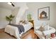 Comfortable bedroom with sloped ceilings, light walls and wood floors at 78 Beverly Ne Rd, Atlanta, GA 30309