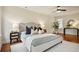 Large bedroom with tufted headboard and hardwood flooring at 78 Beverly Ne Rd, Atlanta, GA 30309