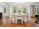 Bright dining room with hardwood floors, modern lighting, and large windows offering natural light at 78 Beverly Ne Rd, Atlanta, GA 30309