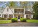 Charming two-story home featuring a balcony, manicured landscaping, and a welcoming entrance at 78 Beverly Ne Rd, Atlanta, GA 30309