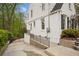 Exterior view of a white brick home with a side entrance and greenery at 78 Beverly Ne Rd, Atlanta, GA 30309