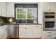Well-equipped kitchen featuring stainless appliances, granite countertops, and ample cabinet space at 78 Beverly Ne Rd, Atlanta, GA 30309