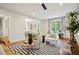Inviting living room with hardwood floors, comfortable seating, and views into other living spaces at 78 Beverly Ne Rd, Atlanta, GA 30309