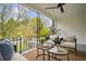 Inviting porch with cozy seating, a ceiling fan, and a view of the neighborhood at 78 Beverly Ne Rd, Atlanta, GA 30309