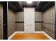 Room with hardwood flooring, diamond wallpaper, black trim, and a door at 78 Beverly Ne Rd, Atlanta, GA 30309