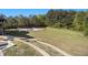 Spacious backyard featuring a sport court area, concrete stairs, and a large grassy area at 150 White Tail Ct, Fayetteville, GA 30214