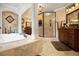 Luxurious bathroom featuring a soaking tub, walk-in shower, and dual vanities at 150 White Tail Ct, Fayetteville, GA 30214