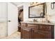 Well-lit bathroom featuring granite countertops, custom cabinets, and tiled floors at 150 White Tail Ct, Fayetteville, GA 30214