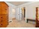 Bedroom with beige carpet, wood dresser and a view of walk-in closets at 150 White Tail Ct, Fayetteville, GA 30214