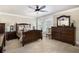 Bedroom features traditional wood furniture, neutral walls, carpet, and natural light at 150 White Tail Ct, Fayetteville, GA 30214