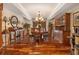 Elegant dining room with hardwood floors, crown molding, and stylish furniture at 150 White Tail Ct, Fayetteville, GA 30214
