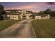 Grand estate showcasing a long driveway and expansive manicured lawn at 150 White Tail Ct, Fayetteville, GA 30214