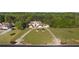 Well-maintained property featuring lush landscaping and a large driveway leading to an elegant home at 150 White Tail Ct, Fayetteville, GA 30214