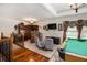 Spacious game room featuring a pool table, bar area, and comfortable seating at 150 White Tail Ct, Fayetteville, GA 30214