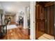 Hallway showing hardwoods, stylish decor, and convenient in-home elevator at 150 White Tail Ct, Fayetteville, GA 30214