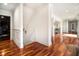 Wide hallway boasting gleaming hardwood floors and white trim at 150 White Tail Ct, Fayetteville, GA 30214