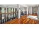 Open hallway overlooking the living room, featuring hardwood floors and wrought iron railings at 150 White Tail Ct, Fayetteville, GA 30214