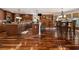 Spacious kitchen with an eat-in area featuring hardwood floors, an island, and stainless appliances at 150 White Tail Ct, Fayetteville, GA 30214