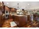 Gourmet kitchen featuring custom wood cabinets, granite counters and stainless steel appliances at 150 White Tail Ct, Fayetteville, GA 30214