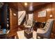 Cozy living room with wood paneled walls, hardwood floors, and comfortable seating at 150 White Tail Ct, Fayetteville, GA 30214