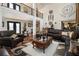 Grand living room with soaring ceilings, gleaming hardwoods and elegant finishes at 150 White Tail Ct, Fayetteville, GA 30214