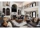 Spacious living room with a fireplace, hardwood floors, and comfortable leather sofas at 150 White Tail Ct, Fayetteville, GA 30214