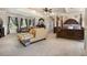 Expansive main bedroom with sitting area, canopy bed, and natural light at 150 White Tail Ct, Fayetteville, GA 30214