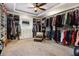 Large walk-in closet with custom shelving and ample storage space for clothing and accessories at 150 White Tail Ct, Fayetteville, GA 30214