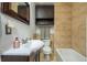 Cozy bathroom featuring tiled walls and floors, toilet, vanity, sink, and a shower at 354 Greenwood Ave, Decatur, GA 30030