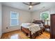 Comfortable bedroom with hardwood floors, a ceiling fan, and great natural light at 354 Greenwood Ave, Decatur, GA 30030