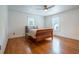 Inviting bedroom with wood floors, a ceiling fan, and natural light from two windows at 354 Greenwood Ave, Decatur, GA 30030