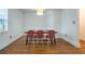 Well-lit dining area with hardwood floors, a modern light fixture, and seating for four at 354 Greenwood Ave, Decatur, GA 30030