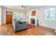 Cozy living room with fireplace, sofa, and plenty of natural light at 354 Greenwood Ave, Decatur, GA 30030