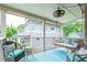 Relaxing porch with swing, comfortable chairs and an outdoor ceiling fan at 354 Greenwood Ave, Decatur, GA 30030