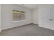 Cozy bedroom features carpet flooring, one window and a closet at 399 Tillman Pass, Woodstock, GA 30188