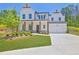 Beautiful two-story home with white siding, manicured lawn, and inviting front porch at 399 Tillman Pass, Woodstock, GA 30188