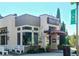 Charming eatery with a modern design, outdoor seating, and eye-catching signage at 399 Tillman Pass, Woodstock, GA 30188