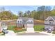 Charming two-story home with a manicured lawn, inviting curb appeal, and a three car garage at 399 Tillman Pass, Woodstock, GA 30188