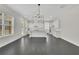 Bright open kitchen with white cabinets, granite countertops, stainless appliances, and a large island at 399 Tillman Pass, Woodstock, GA 30188