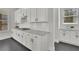 Stylish kitchen featuring white cabinets, granite countertops, and a built-in gas range at 399 Tillman Pass, Woodstock, GA 30188