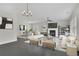 Elegant living room with fireplace, contemporary furnishings, and ample natural light at 399 Tillman Pass, Woodstock, GA 30188