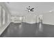 Open concept living room showcasing modern design, sleek gray flooring, and natural light at 399 Tillman Pass, Woodstock, GA 30188