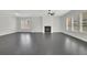 Bright living room with a fireplace and large windows, showcasing a modern and open space at 399 Tillman Pass, Woodstock, GA 30188