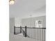 Second story loft showcases plush carpet and a staircase overlooking the neighborhood at 399 Tillman Pass, Woodstock, GA 30188