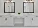 Bright bathroom with double vanity, dual mirrors and neutral cabinets at 399 Tillman Pass, Woodstock, GA 30188