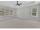 Spacious bedroom with carpet floors, tray ceiling and abundant natural light at 399 Tillman Pass, Woodstock, GA 30188