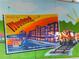Colorful mural in Woodstock Georgia with a train and a postcard-like design that reads, Wish you were here! at 399 Tillman Pass, Woodstock, GA 30188