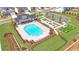 Aerial view of a neighborhood pool with a grilling area, lounge chairs, and recreation area at 399 Tillman Pass, Woodstock, GA 30188