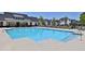 Community pool with ample seating and a bathhouse in a well-maintained neighborhood at 399 Tillman Pass, Woodstock, GA 30188