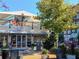 Outdoor dining area with a covered patio at a restaurant with an inviting atmosphere at 399 Tillman Pass, Woodstock, GA 30188